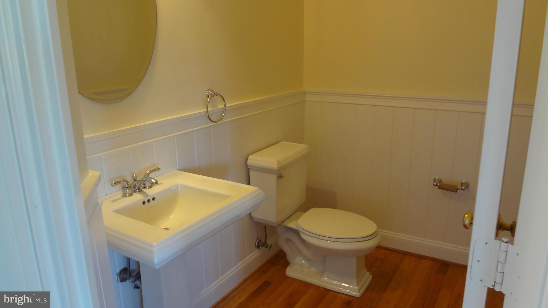 15900 Barnesville Road Boyds, MD 20841 - Photo 9 of 30 a bathroom with a sink a toilet and a mirror