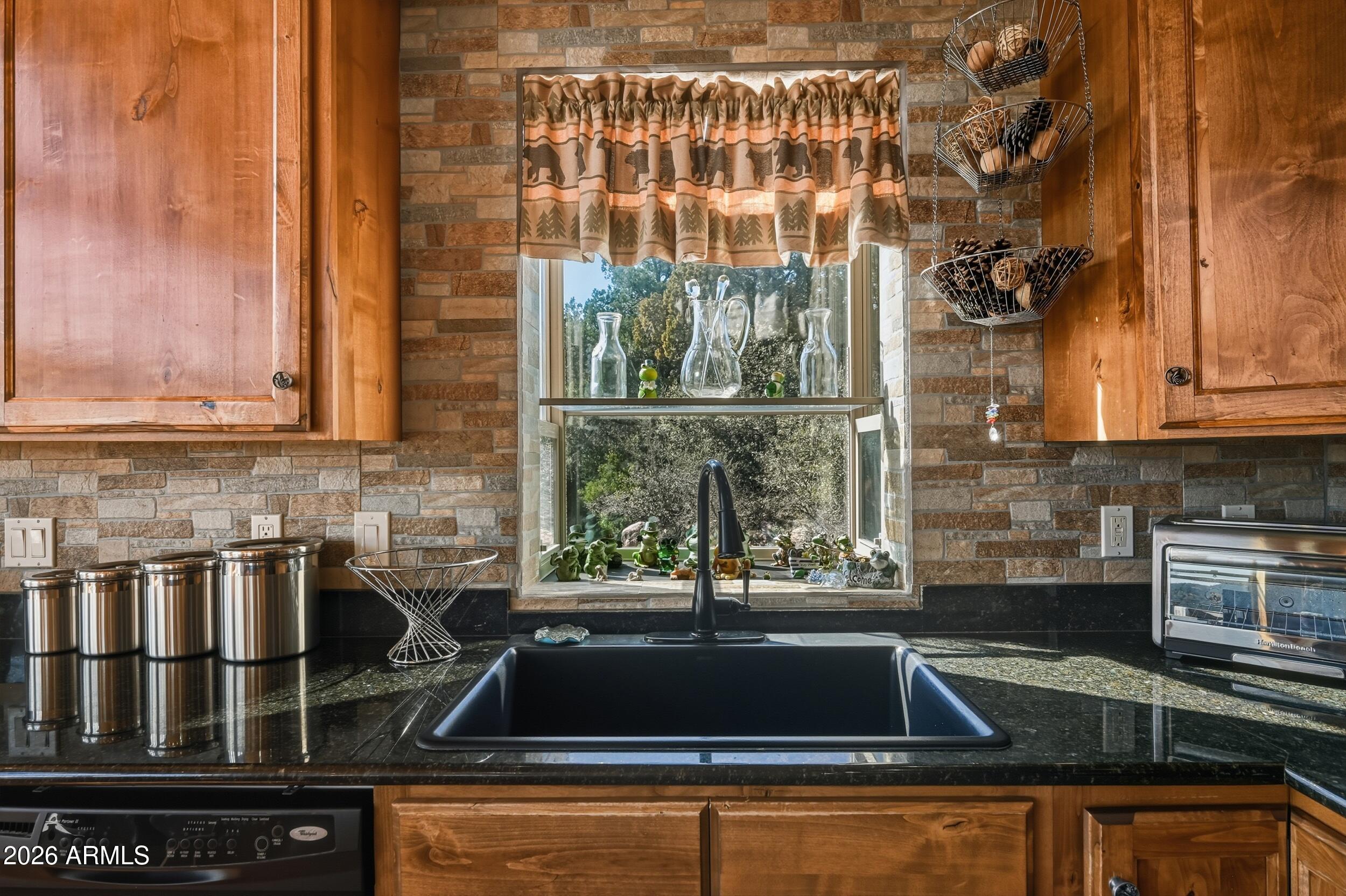 3119 Kysar Way Pine, AZ 85544 - Photo 16 of 68 a kitchen with a sink and cabinets