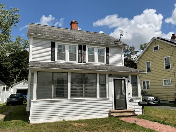a front view of a house with a yard