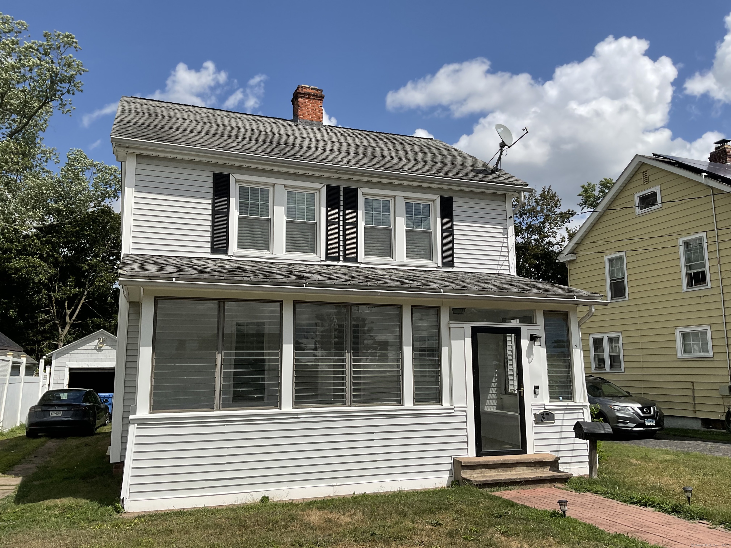37 Westminster Street Hamden, CT 06518 - Photo 2 of 33 a front view of a house with a yard