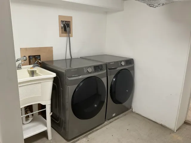 a utility room with dryer and washer