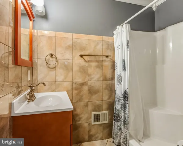 a view of a livingroom with workspace and a window