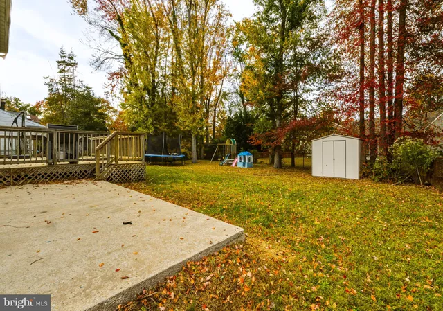 a view of a balcony with two chairs and wooden floor