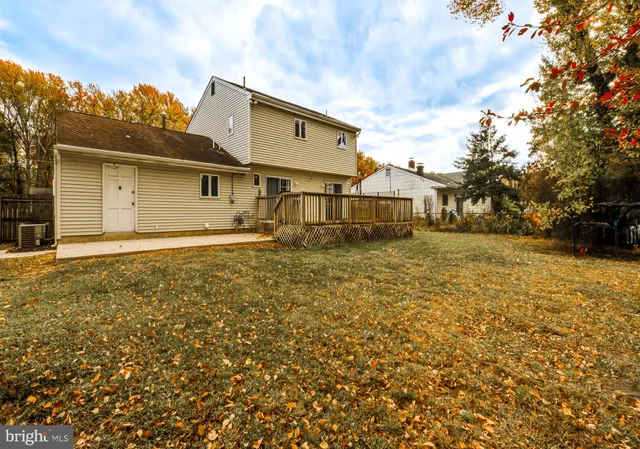 a backyard of a house with lots of trees