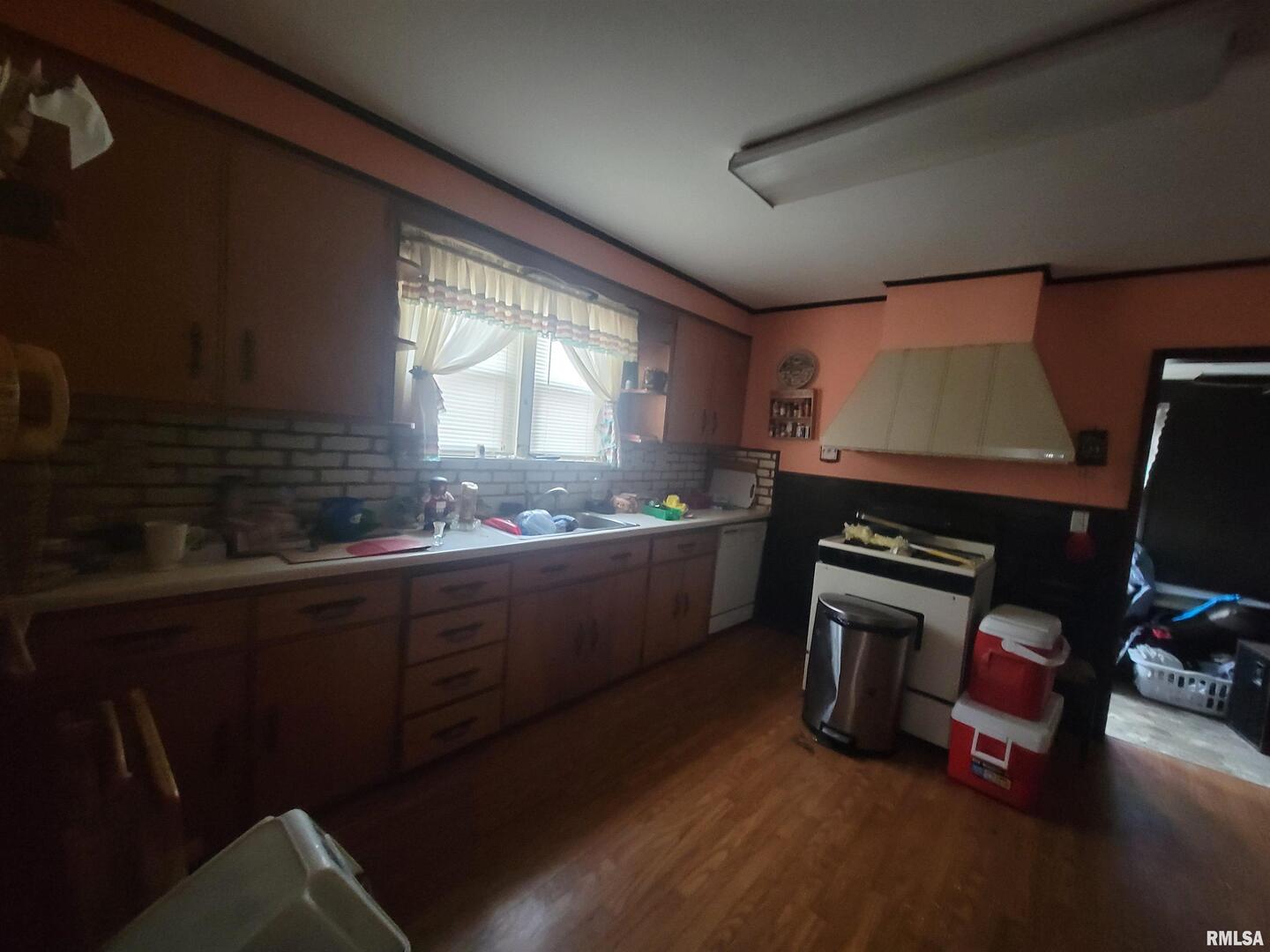 905 West Monroe Street Herrin, IL 62948 - Photo 8 of 14 a kitchen with sink window and cabinets