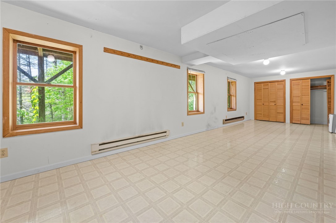 233 Alpine Acres Road Vilas, NC 28692 - Photo 20 of 32 an empty room with windows