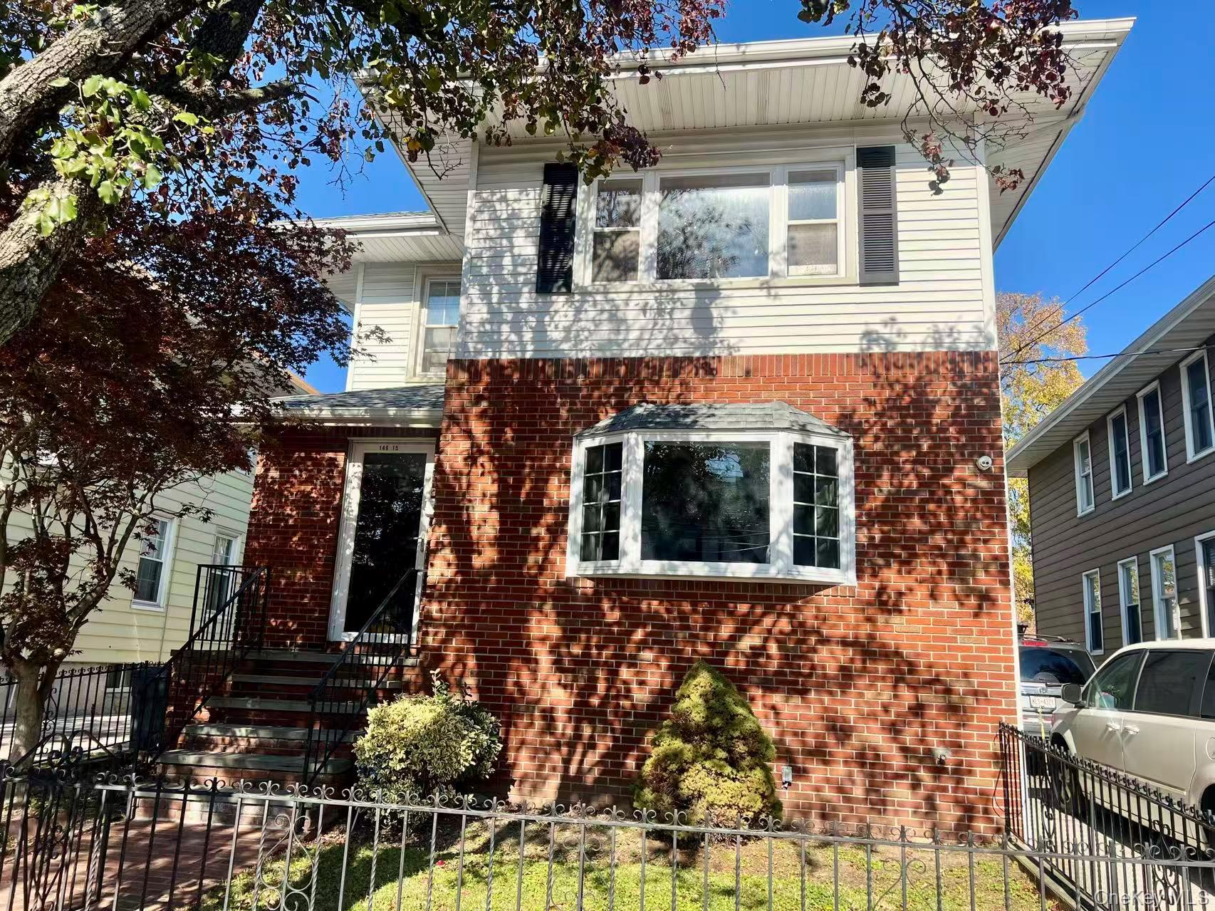 149-15 15th Road Queens, NY 11357 - Photo 1 of 20 a front view of a house with glass windows