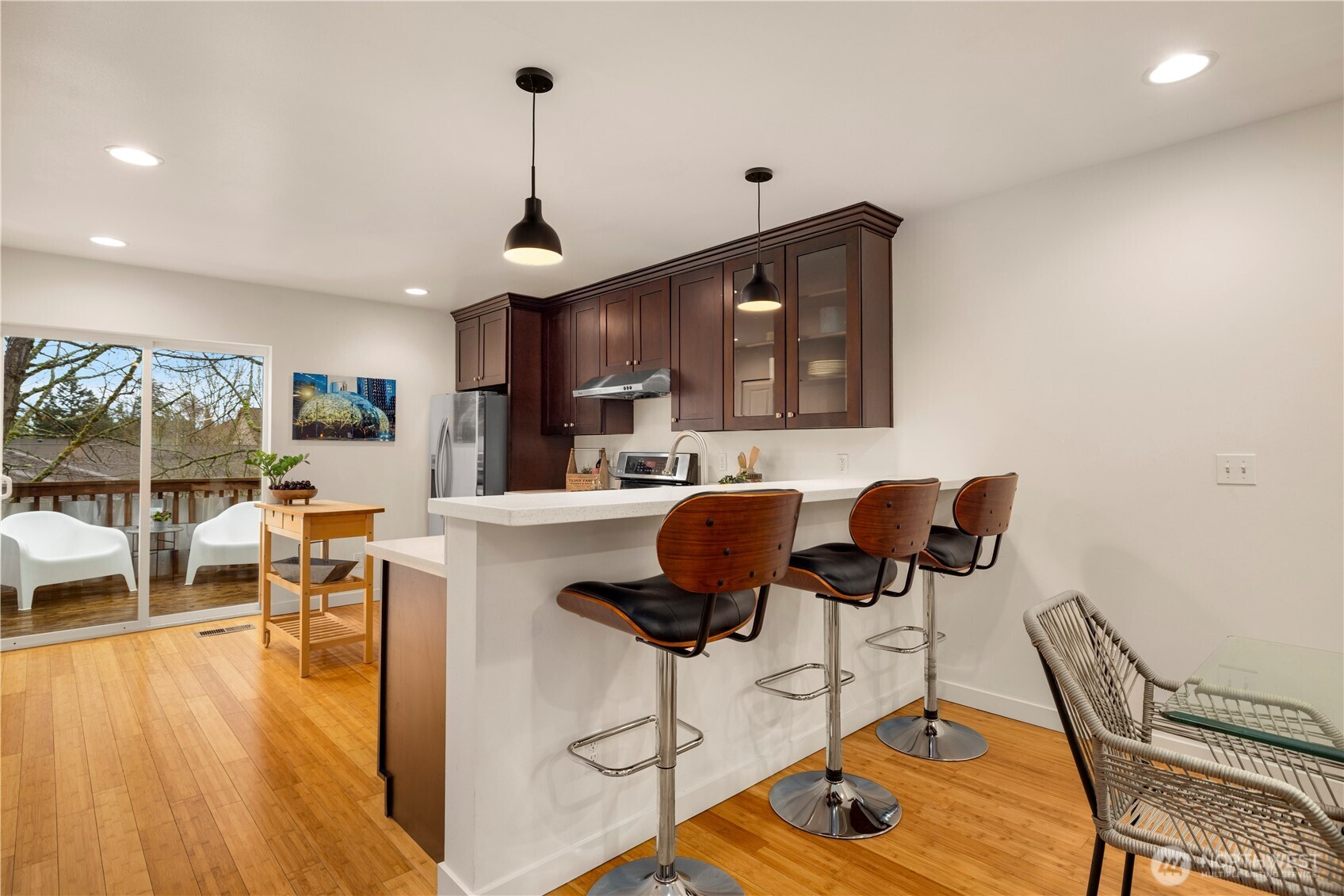 1029 Southwest 124th Street Burien, WA 98146 - Photo 13 of 40 a living room with furniture a wooden floor and a chandelier