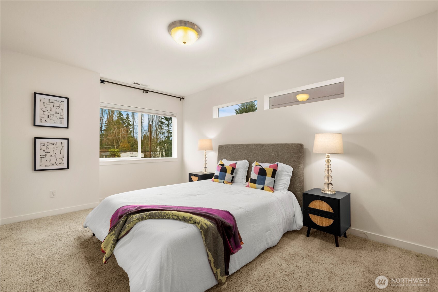 1029 Southwest 124th Street Burien, WA 98146 - Photo 18 of 40 a bedroom with a bed and a lamp on table