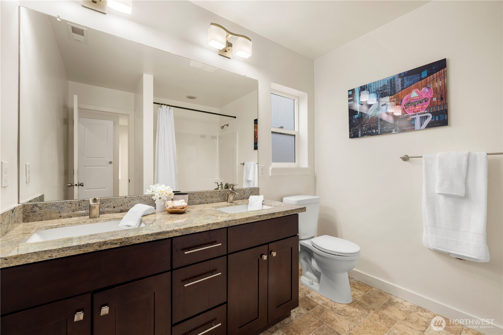 1029 Southwest 124th Street Burien, WA 98146 - Photo 27 of 40 a bathroom with a double vanity sink toilet and a mirror