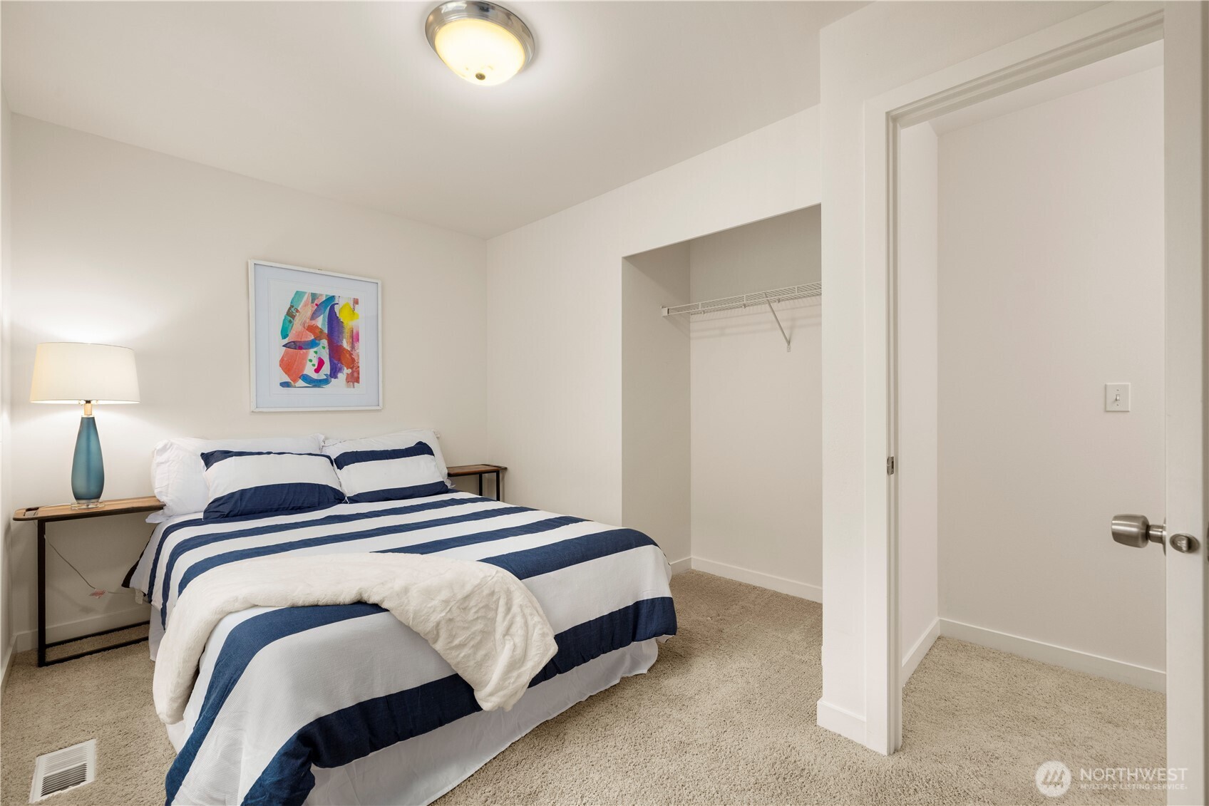 1029 Southwest 124th Street Burien, WA 98146 - Photo 28 of 40 a bedroom with a bed and a painting on the wall