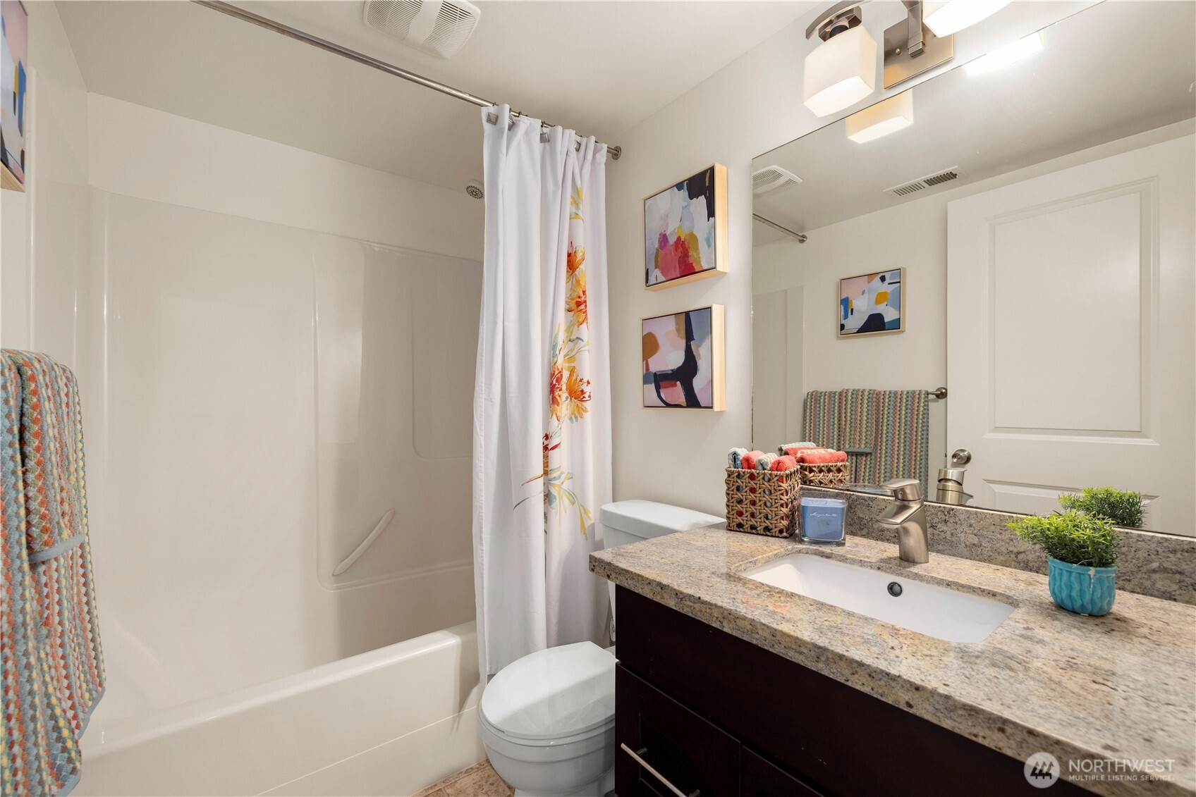 1029 Southwest 124th Street Burien, WA 98146 - Photo 33 of 40 a bathroom with a granite countertop sink toilet and shower