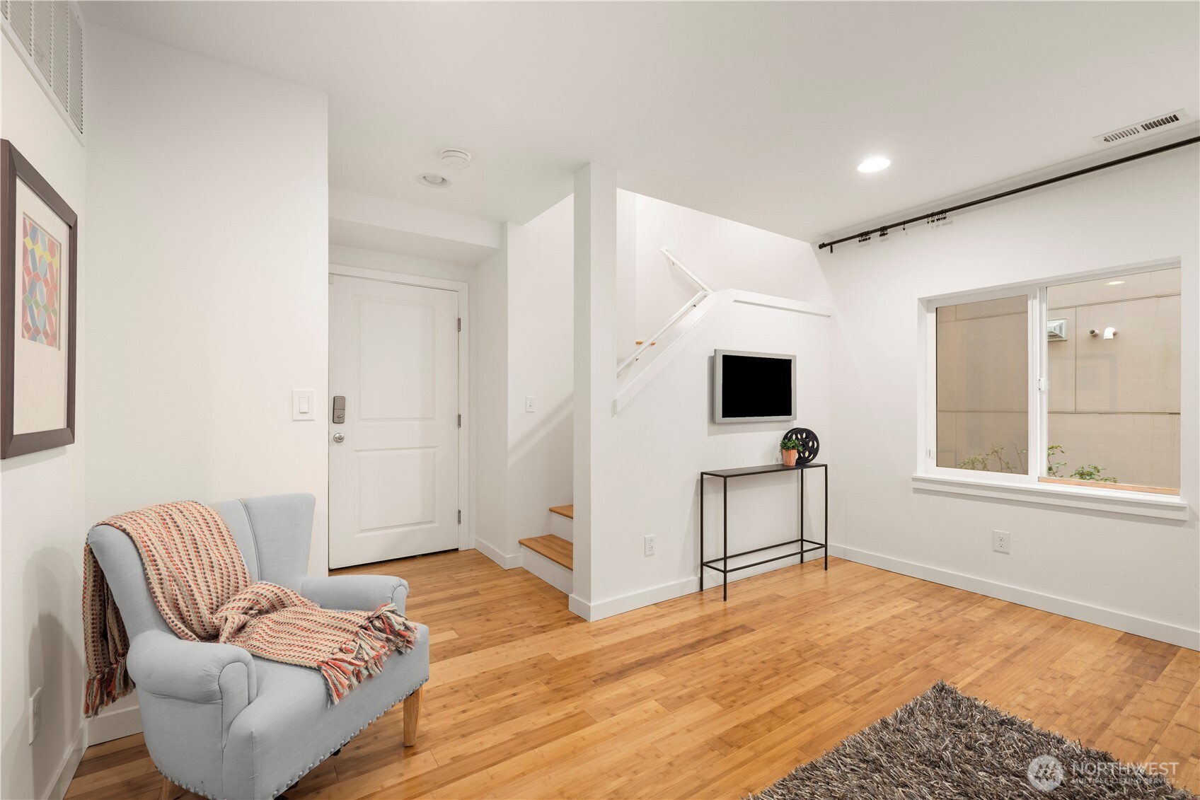 1029 Southwest 124th Street Burien, WA 98146 - Photo 34 of 40 a bedroom with a bed and flat screen tv