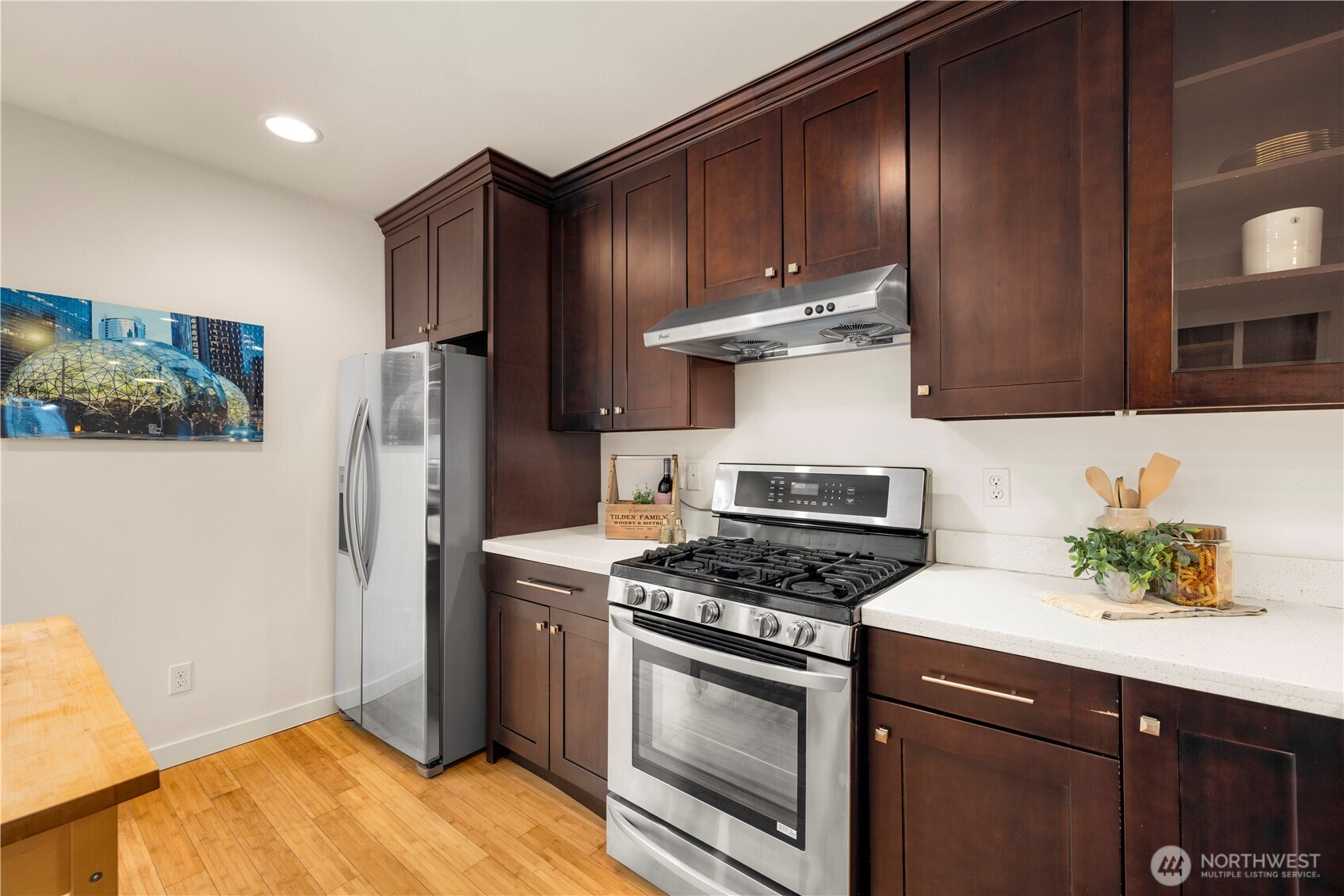 1029 Southwest 124th Street Burien, WA 98146 - Photo 10 of 40 a kitchen with stainless steel appliances a stove a microwave and a refrigerator