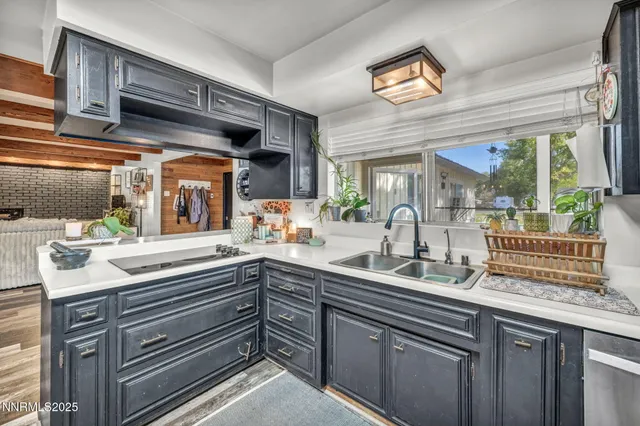 a workspace with furniture window and wooden floor