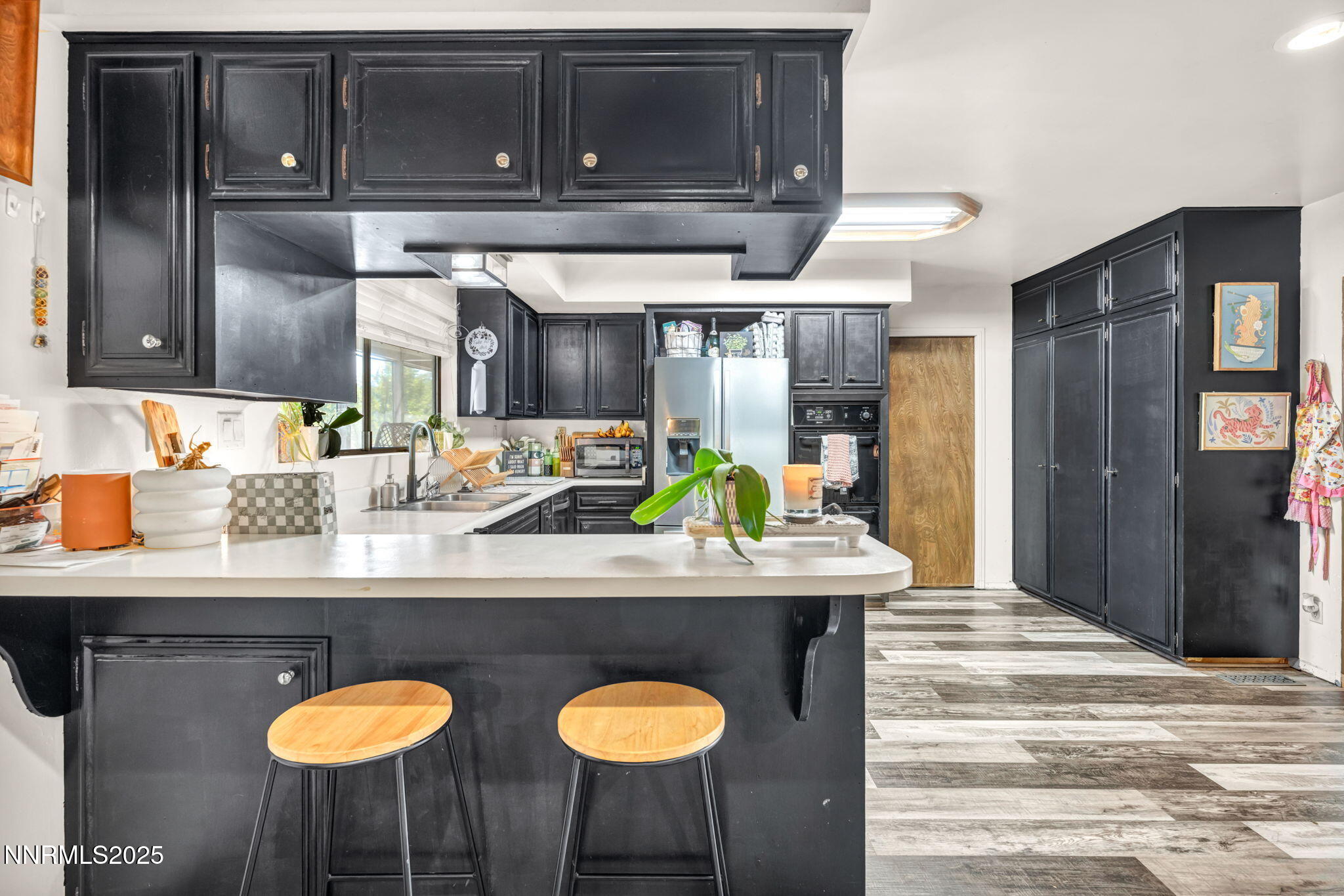 2998 Alcorn Road Fallon, NV 89406 - Photo 12 of 42 a kitchen with stainless steel appliances granite countertop a sink a stove and a wooden cabinets