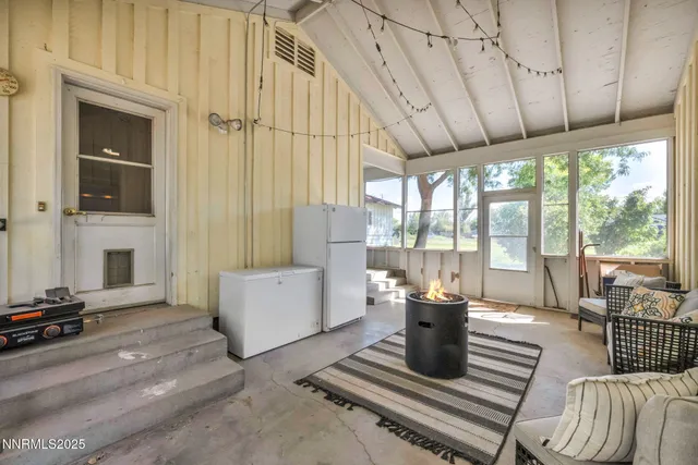 a bedroom with furniture and a window