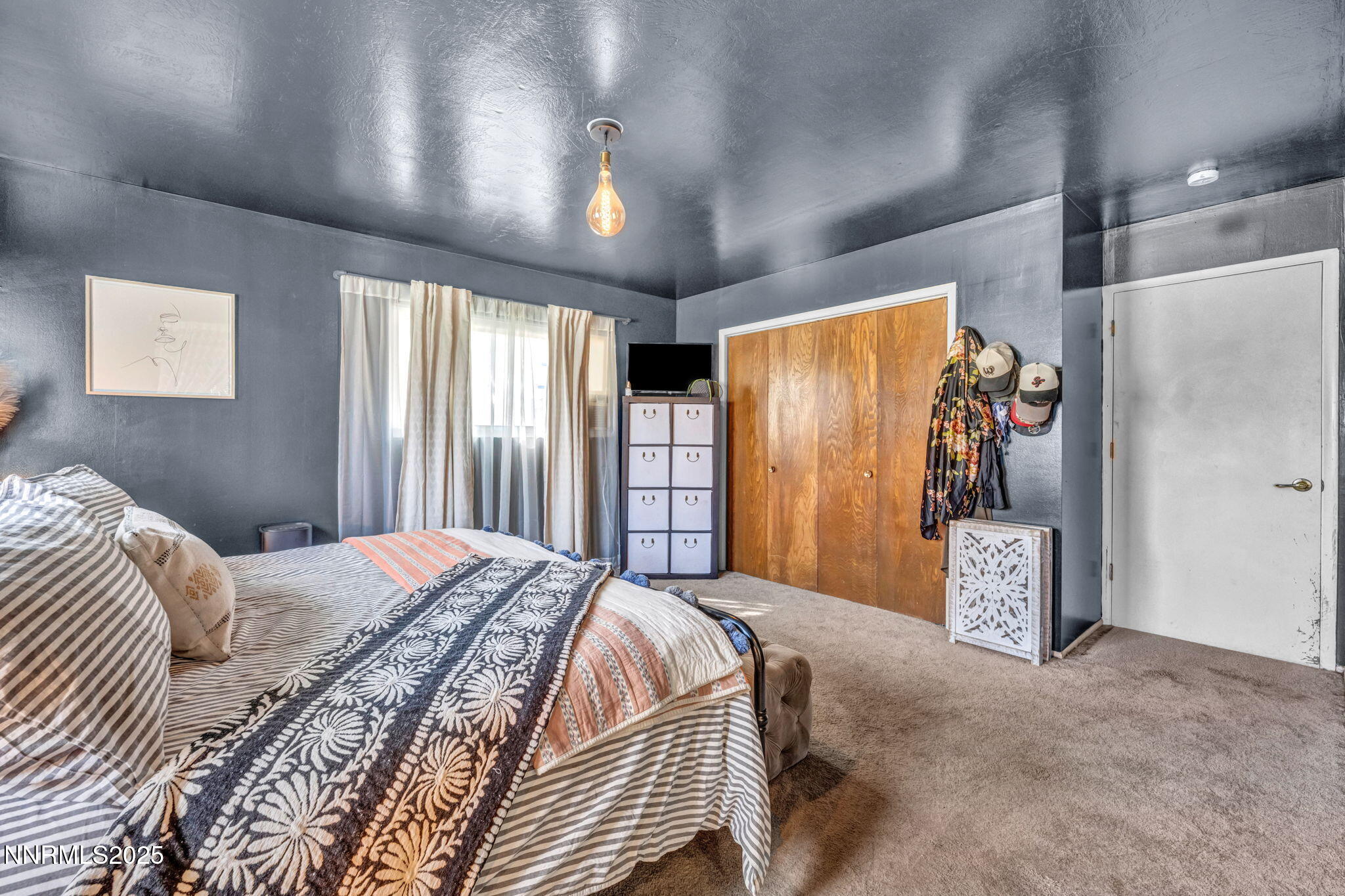 2998 Alcorn Road Fallon, NV 89406 - Photo 24 of 42 a bedroom with a bed and a walk in closet