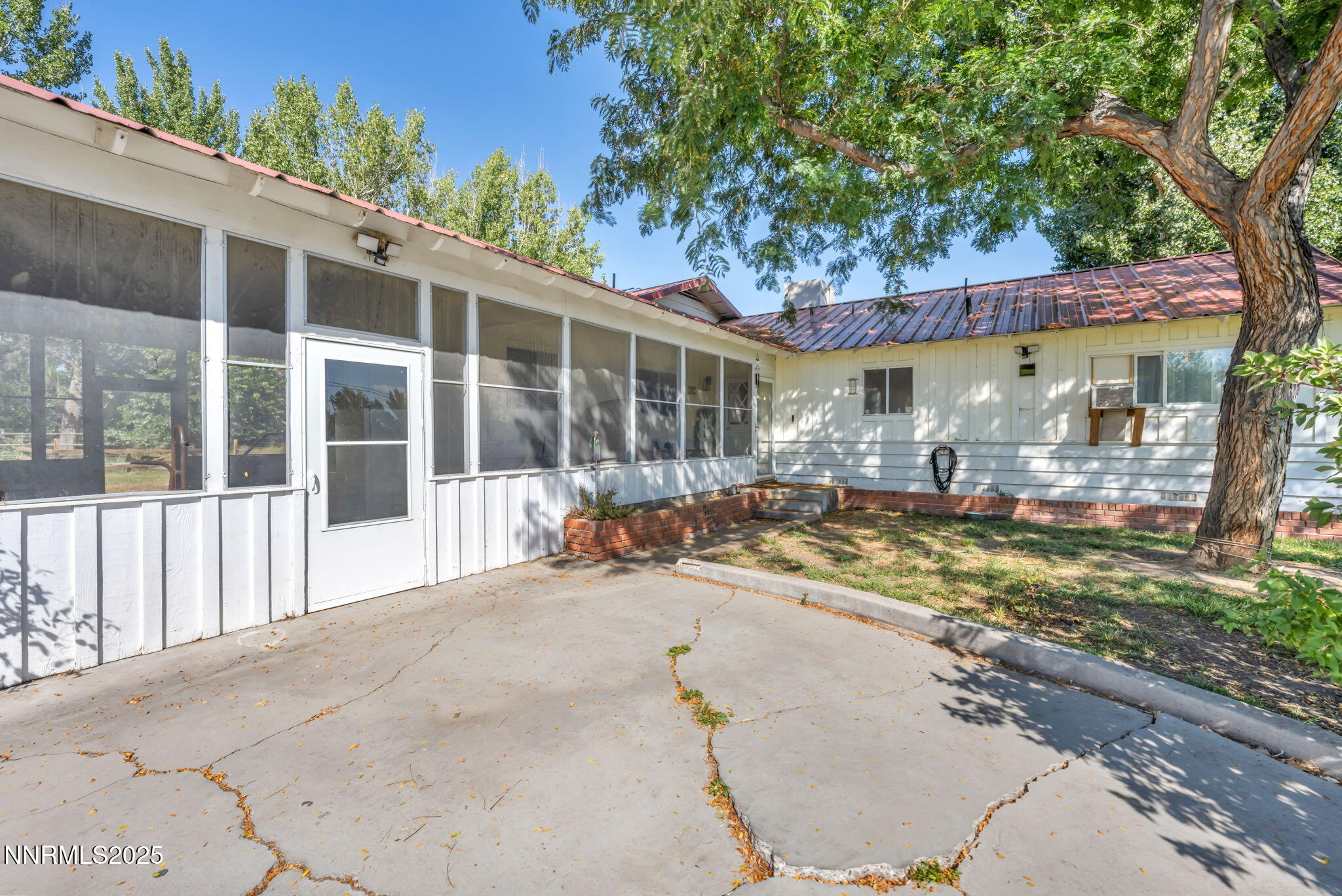 2998 Alcorn Road Fallon, NV 89406 - Photo 4 of 42 a view of a house with a patio and a yard