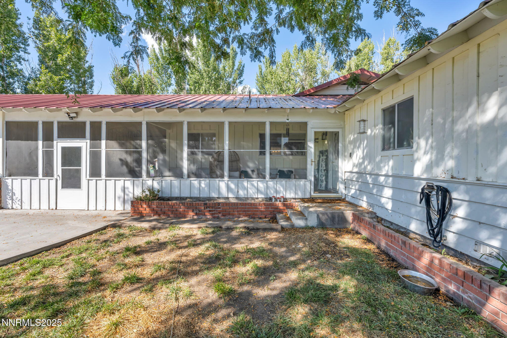 2998 Alcorn Road Fallon, NV 89406 - Photo 5 of 42 a view of a house with a large window and wooden fence
