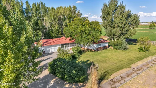 a kitchen with stainless steel appliances kitchen island granite countertop a refrigerator and a stove top oven