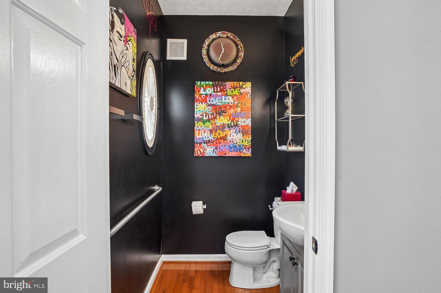 217 Raccoon Run Court Hanover, MD 21076 - Photo 15 of 38 a bathroom with a toilet and a shower curtain