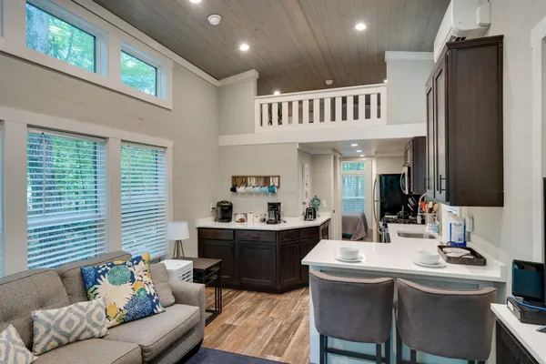 a kitchen with a sink appliances and cabinets