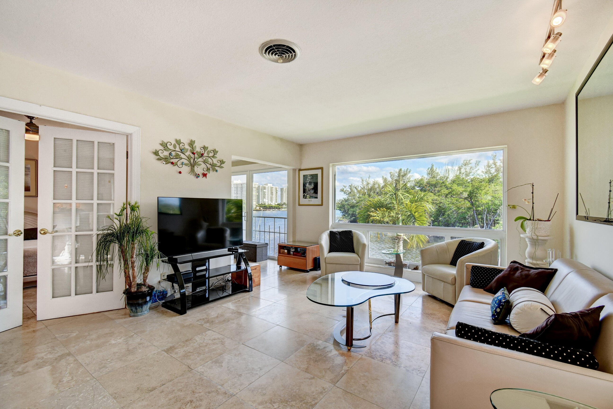 711 Northeast Harbour Terrace, Unit 4120 Boca Raton, FL 33431 - Photo 2 of 28 1 LIving room view SE