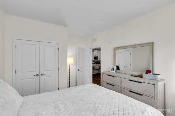 a bedroom with a bed and a closet