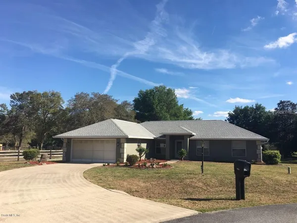a house with trees in front of it