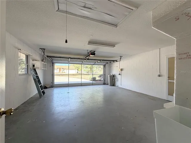 a view of a livingroom with wooden floor and a window