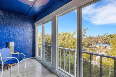 a view of a room with chairs and balcony