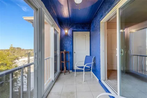 a view of a hallway with furniture and stairs