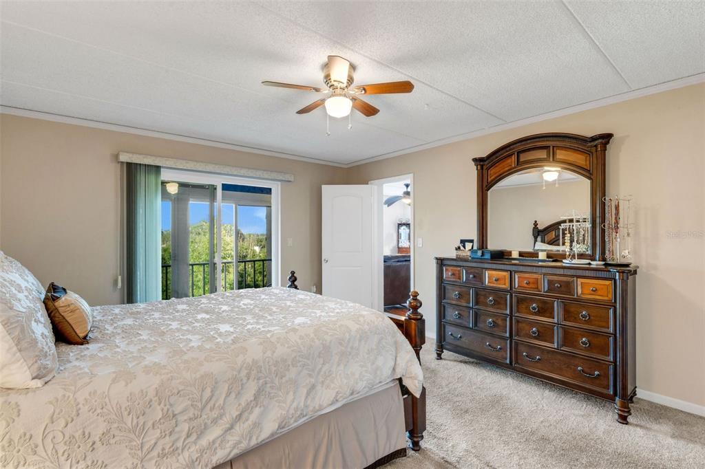 12760 Indian Rocks Road, Unit 119 Largo, FL 33774 - Photo 15 of 24 a bedroom with a bed and a dresser