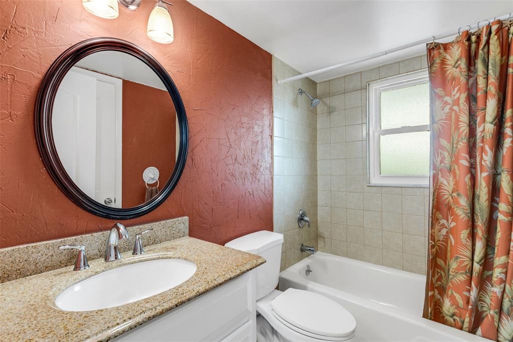 12760 Indian Rocks Road, Unit 119 Largo, FL 33774 - Photo 18 of 24 a bathroom with a sink and a mirror