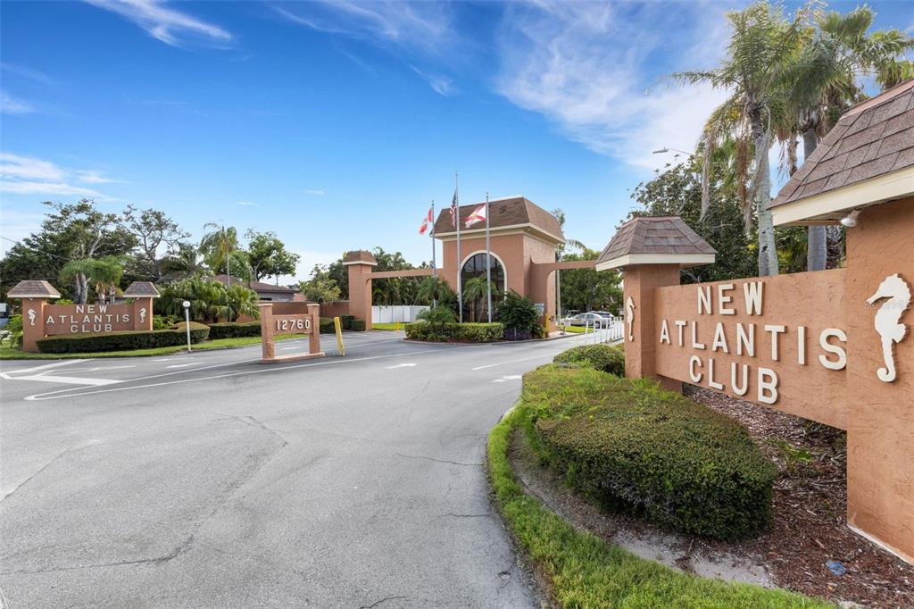 12760 Indian Rocks Road, Unit 119 Largo, FL 33774 - Photo 2 of 24 a front view of a house with a yard and trees