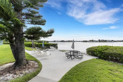 a view of a backyard with sitting area
