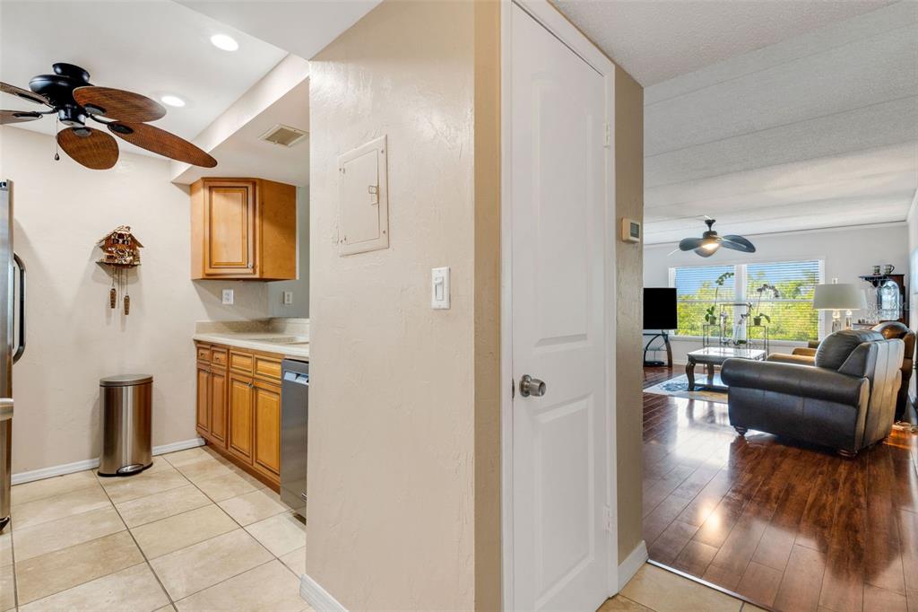 12760 Indian Rocks Road, Unit 119 Largo, FL 33774 - Photo 7 of 24 a view of living room kitchen with furniture and wooden floor