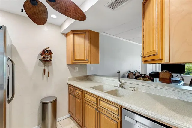 a kitchen with a sink and a refrigerator