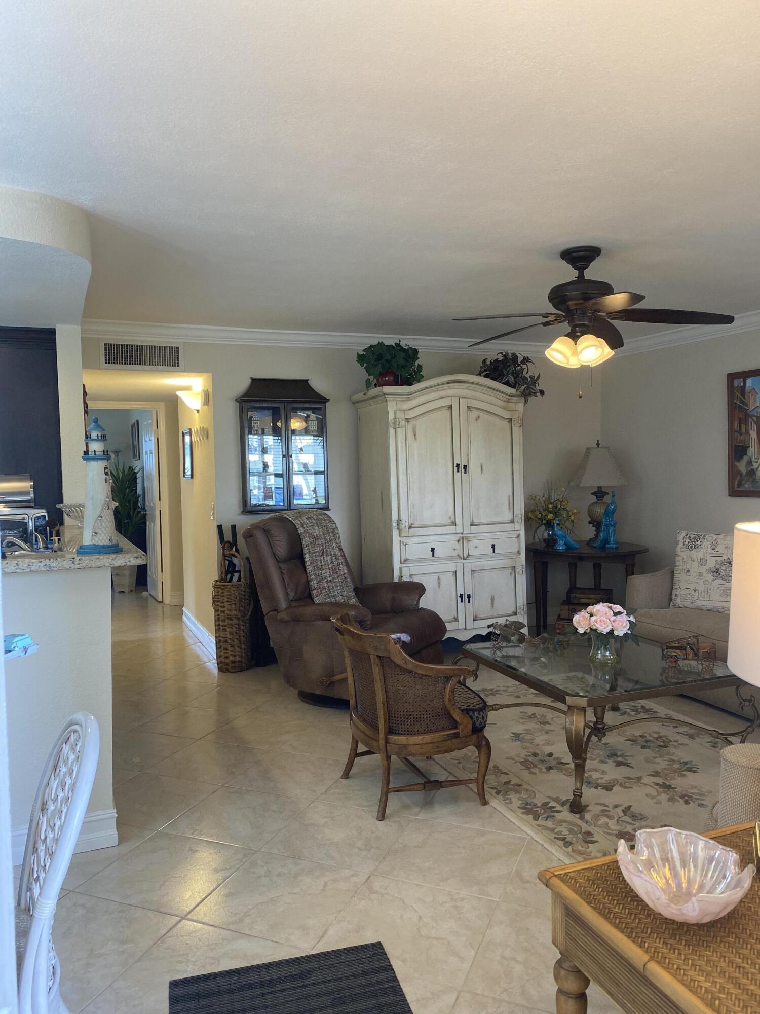 148 Normandy Lane Delray Beach, FL 33484 - Photo 1 of 29 a living room with furniture and wooden floor