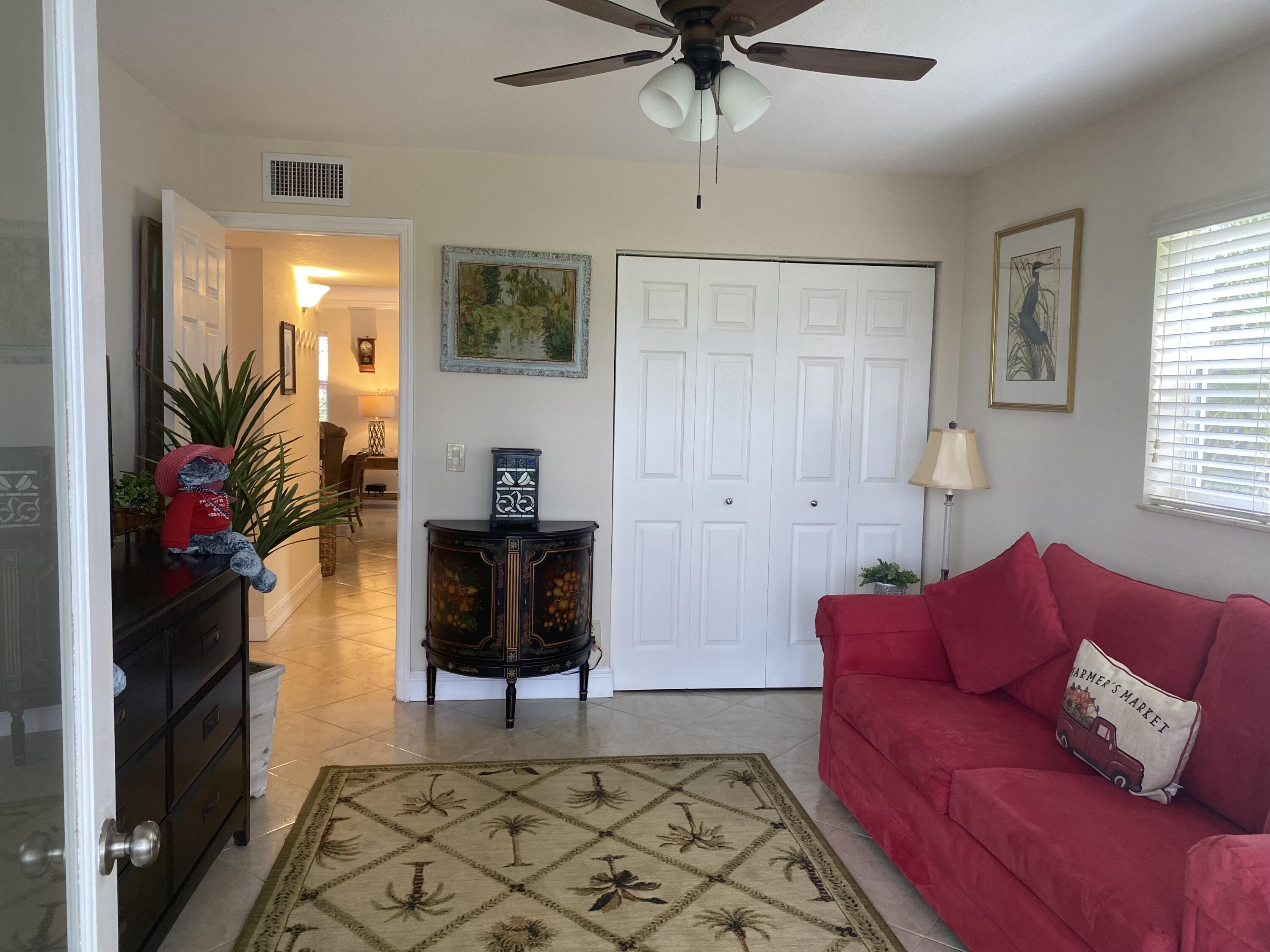 148 Normandy Lane Delray Beach, FL 33484 - Photo 14 of 29 a living room with furniture and a window