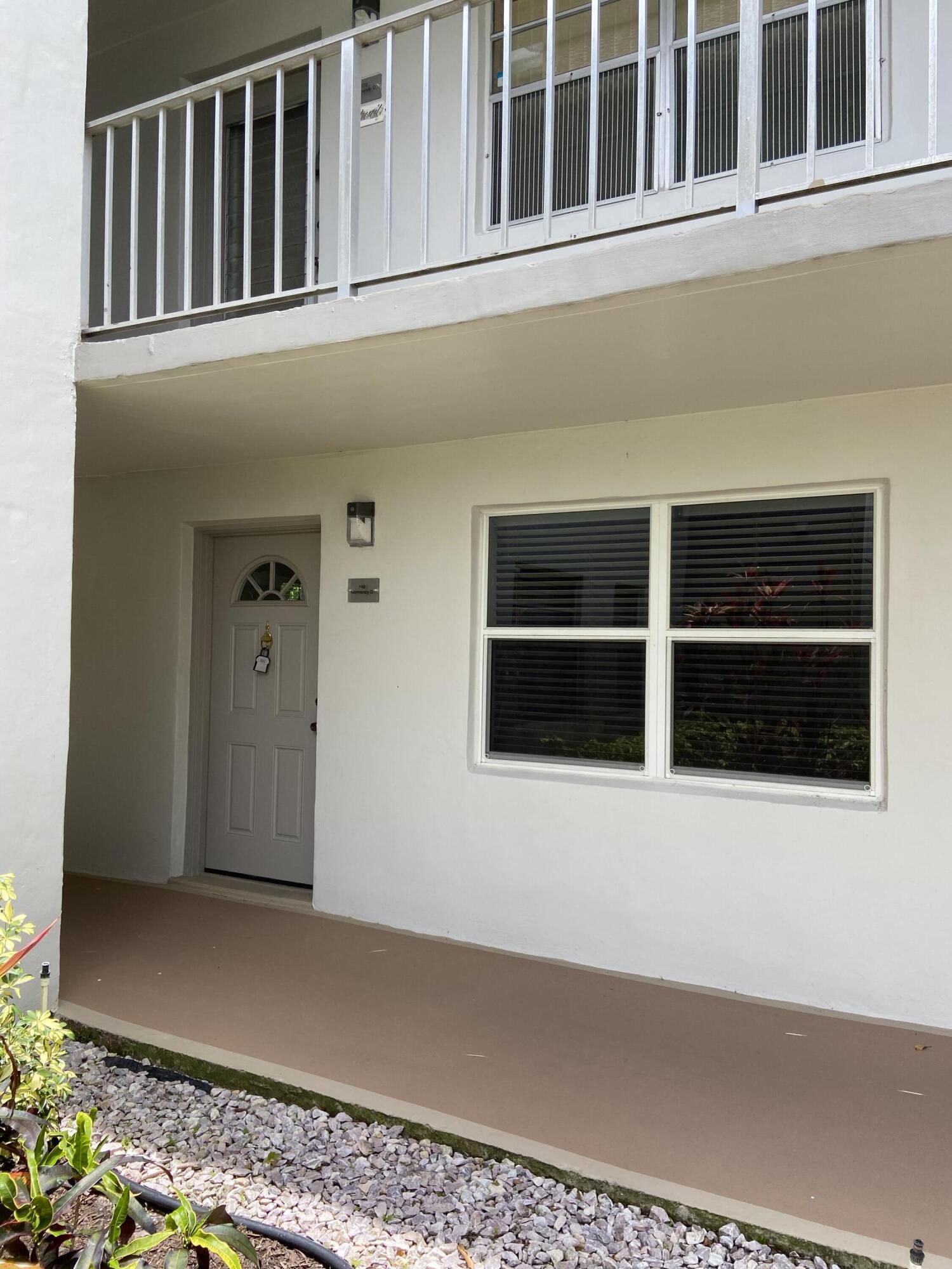 148 Normandy Lane Delray Beach, FL 33484 - Photo 27 of 29 a view of a house with a large window