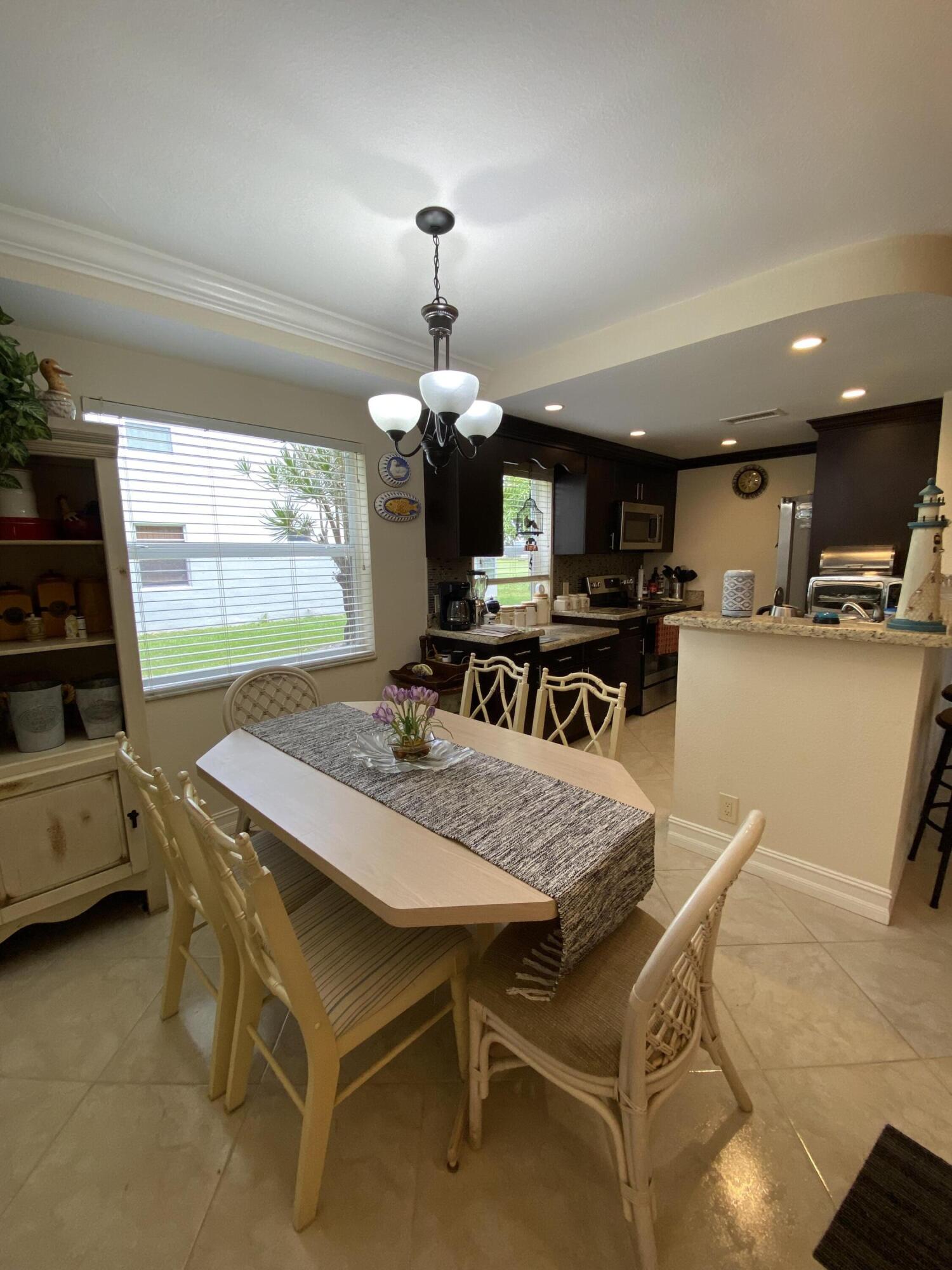 148 Normandy Lane Delray Beach, FL 33484 - Photo 3 of 29 a view of a dining room with furniture