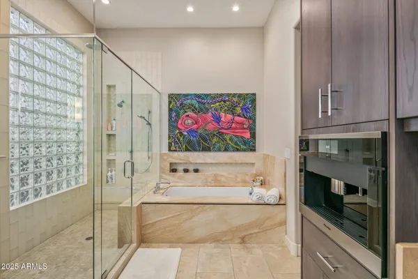 a bathroom with a tub and a shower