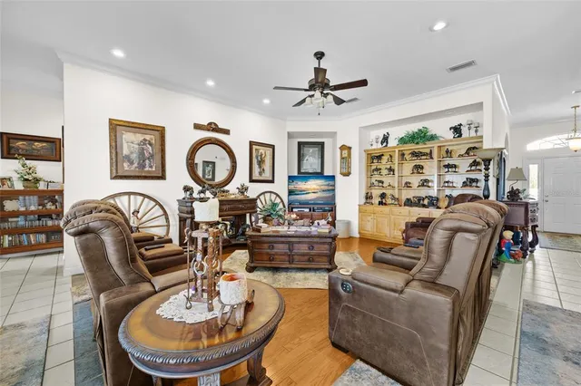 a living room with furniture a rug and a flat screen tv