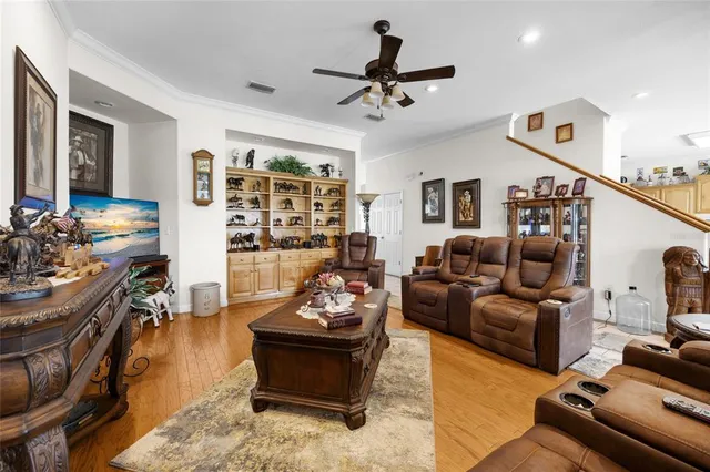 a bedroom with furniture and a wooden floor