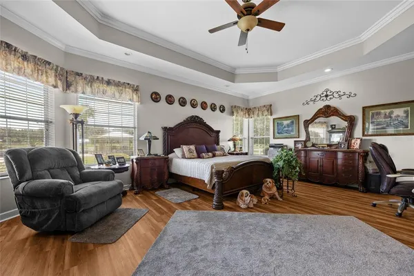 a living room with furniture a flat screen tv and a dresser