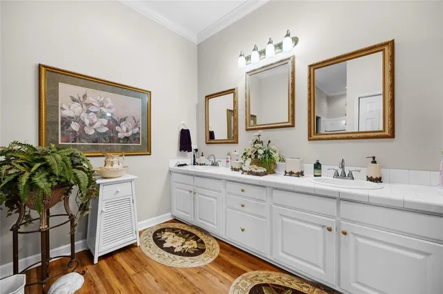 a living room with furniture a chandelier and a window