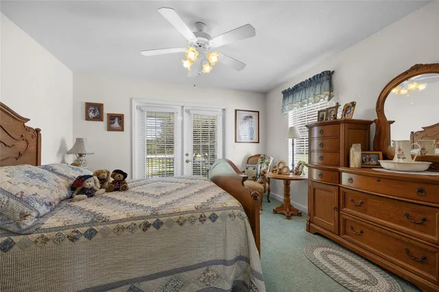 a view of a hallway and a livingroom with furniture