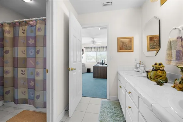 a view of a swimming pool with a lawn chairs and a fire pit